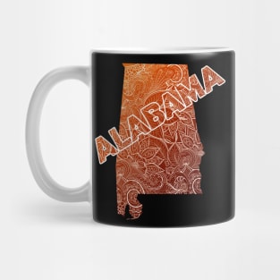 Colorful mandala art map of Alabama with text in brown and orange Mug